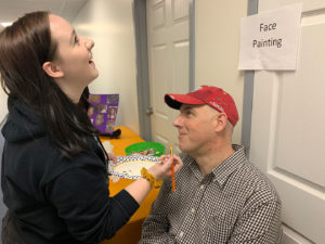 Steve making Aubrey laugh while painting his face.