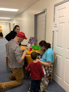 Pastor Steve jumping in to help paint faces.