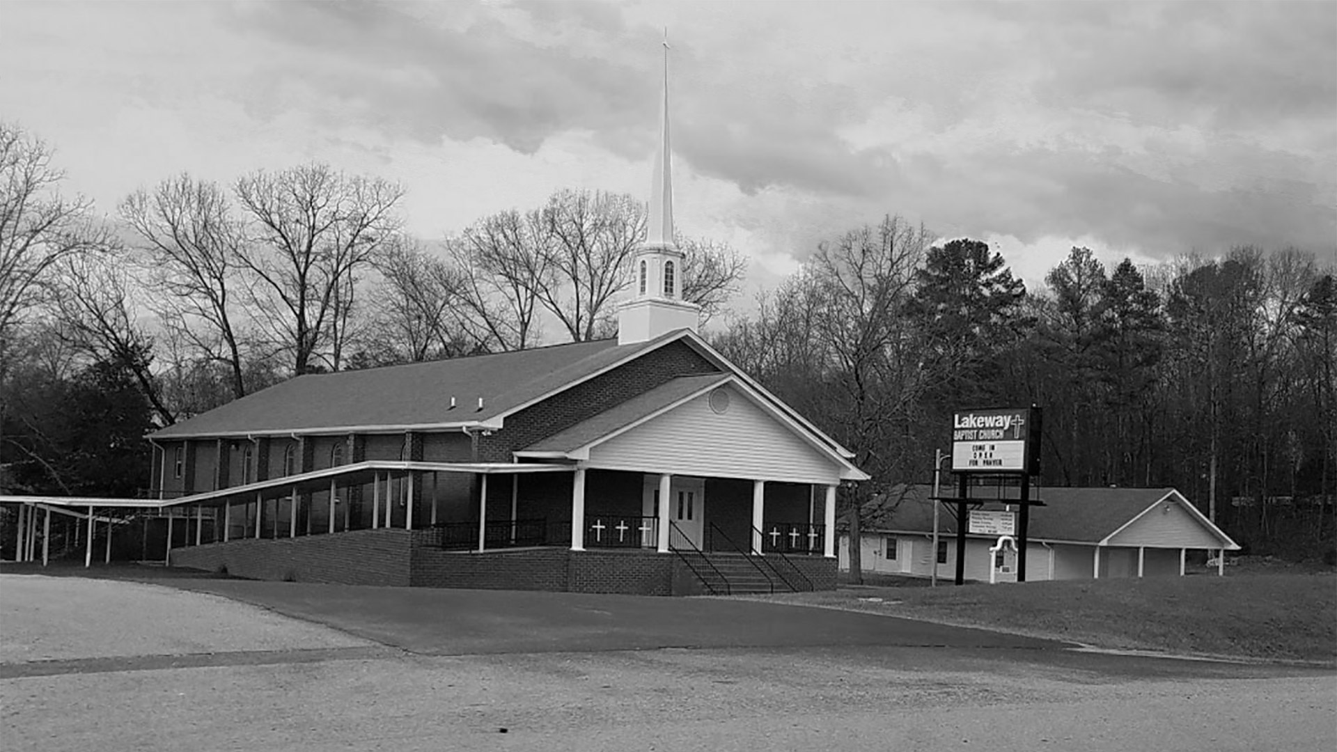 Exterior of Lakeway Baptist Church in black and white.